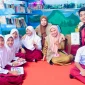 Program kerja “Pojok Literasi Digital Desa Marannu dengan Program Sinkronisasi Aplikasi E-Pusda Maros Berbasis QR Code”. (Foto: Dok. Istimewa)